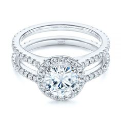 a white gold engagement ring set with round diamonds