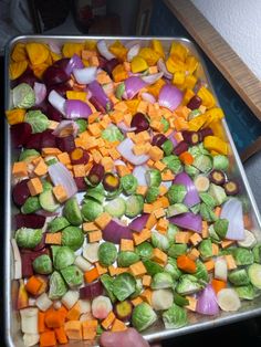 a pan filled with vegetables sitting on top of a counter