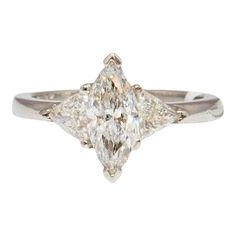 an engagement ring with two pear shaped diamonds