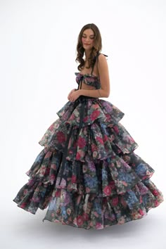 Embody the capricious spirit of Shakespeare's trickster fairy in this two-piece ensemble. A slinky slip dress with a coquettish bow-tied bust meets a voluminous tiered skirt, with an extra-long satin ribbon closure. Scattered blooms dance across the inky canvas, echoing the mischievous footsteps of A Midsummer Night’s beloved Puck. This is a two piece set. Two piece slip dress set with tiered maxi skirt Slip dress features a peek-a-boo cutout and underwire cups with a ribbon bow tie at bust Incl Party Dress With Ruffled Skirt And Crinoline, Spring Party Dress With Crinoline, Trickster Fairy, Silk Dressing Gown, Ruffle Maxi Skirt, Corset Skirt, Puff Dress, Tiered Maxi Skirt, Tiered Skirt