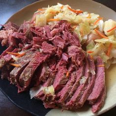 corned beef, cabbage and carrots on a plate