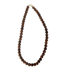 This necklace boasts a clasp closure, showcasing the exquisite natural appearance of Hawaiian Koa Wood, embodied by its 8mm beads. With sizes available in 16, 18, and 20 inches, this popular piece is renowned for its authentic and timeless allure. Material: Koa Wood Bead Size: 8mm Clasp Closing Size: 16 inch | 18 inch | 20 inch Classic Necklace With 8mm Beads For Gift, Classic 8mm Bead Necklaces As Gifts, Classic 8mm Beads Necklace For Gifts, Classic 8mm Bead Necklaces Perfect For Gifts, Classic 8mm Beaded Necklaces As Gift, Brown Necklace With Round Beads And Lobster Clasp, Classic Single Strand Beads As Gift, Formal Brown Necklace With Round Beads, Classic Beaded Necklaces With 8mm Round Beads