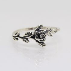 Vintage Sterling Silver Rose Flower Leaf Ring ...Marked 925...Total of weights 1.2grams...Size 7...Measure of Face 8.4MM...It's in very good condition. Rose Sterling Silver Promise Ring, Sterling Silver Rose Flower Ring With Rose Design, Sterling Silver Rose Flower Ring For Anniversary, Rose Sterling Silver Anniversary Ring, Rose Sterling Silver Ring For Anniversary, Adjustable Sterling Silver Flower Ring With Rose Design, Silver Promise Ring With Roses Detail, Adjustable Sterling Silver Rose Design Ring, Silver Flower-shaped Rings With Rose Design