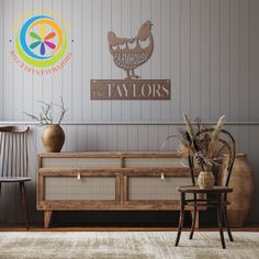 a living room with two chairs, a table and a sign that says the taylors