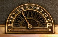 an antique clock with roman numerals on it