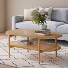 a living room with a couch, coffee table and rug