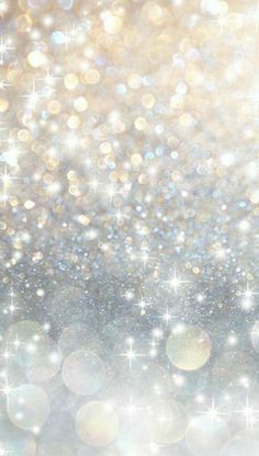 an abstract background with sparkling lights and stars