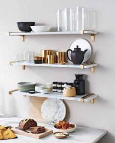 some shelves that have plates and bowls on them