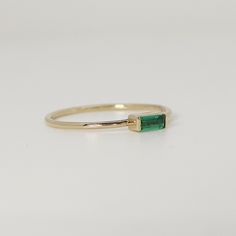 This beautiful baguette emerald Gold Ring was handmade in Melt'm Jewelry Design Studio in California using 14k solid yellow gold band and 4 x 2mm baguette lab grown emerald stone. DETAILS ABOUT THE RING, MATERIAL AND STONES Ring Band: 14K solid gold Ring Band size: 1 mm thick Gemstone: Lab Grown Emerald Emerald size: 4 mmx 2 mm baguette cut It is a great birthday gift for your special ones whose birthday are in May, since Emerald is May birthstone. This solid gold ring makes a perfect present fo Emerald Ring In 14k Yellow Gold With Baguette Diamonds, Emerald Ring With Baguette Diamonds In 14k Yellow Gold, Modern Baguette Cut Emerald Ring For May Birthstone, Minimalist Emerald Cut Emerald Ring For May, 14k Gold Emerald Cut Emerald Ring For Everyday, Everyday Gold Emerald Cut Emerald Ring, Everyday Gold Emerald-cut Emerald Ring, Baguette Cut Emerald Ring For May Birthstone, Everyday Emerald Ring In Yellow Gold