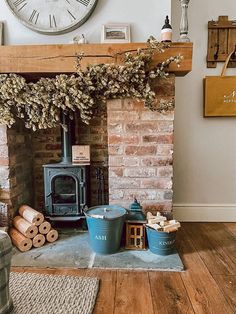 a fireplace with logs and other items on the floor