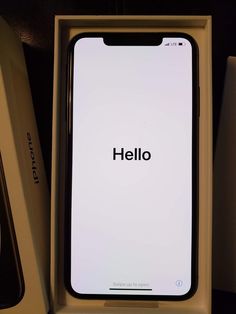 an iphone in a box with the word hello on it's back and side