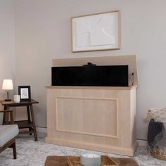 a living room with a television on top of the entertainment center