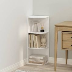 a corner shelf with some books on it next to a table and chair in a room