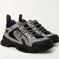 First Presented In The Fall-Winter 2018 Collection, These Unisex Hiking Sneakers Are Reintroduced For Cruise 2019 In Reflective Fabric, Mixed With Technical Canvas And Leather. The Gucci Logo Is Displayed In A Graphic Font With A Nod To The Eighties References That Run Through The Collection.; Grey Reflective Fabric With Black Mesh Brand Nwt In Box , Separate Dust Bags And All Paperwork Comes With This Stunning Piece . Men’s Size 5 And Women’s Size 7 Gucci Sporty High-top Sneakers For Streetwear, Black Sporty Gucci High-top Sneakers, Gucci Luxury High-top Sneakers For Streetwear, Designer Black Gucci High-top Sneakers, Luxury Gucci High-top Sneakers For Streetwear, Gucci Sneakers For Sports With Laces, Gucci Sneakers With Laces For Sports, Gucci Black Lace-up High-top Sneakers, Gucci Designer High-top Sneakers For Streetwear