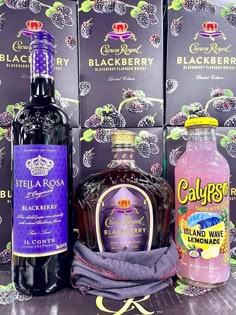 several bottles of liquor are sitting next to each other in front of blackberry boxes