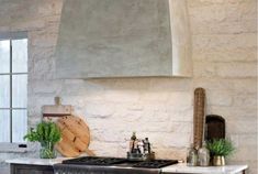 a kitchen with an oven, stove and counter top in the middle of it's room