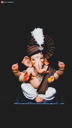 an elephant statue sitting on top of a wooden table next to a black background with the words happy ganeshi written below it