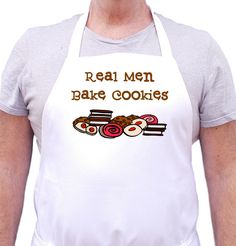 a man wearing an apron that says real men bake cookies and rolls on it