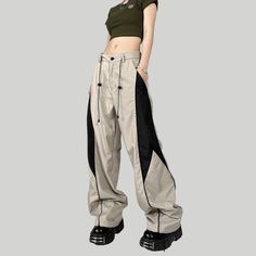 Experience comfort and style with these Women's American Switching Sweatpants. With a luxurious blend of fabric and a tailored fit that accentuates the wearer's figure, these sweatpants are sure to become your go-to for days when you want to feel stylish and comfortable. Features: -30% Cotton.0% Polyester -High-rise Waist -Loose -Patchwork -Regural Fit -Vintage Style Stretch Wide-leg Parachute Pants For Streetwear, Straight Cargo Pants For Streetwear Athleisure, Athleisure Straight Cargo Pants For Streetwear, Nylon Wide-leg Pants For Streetwear, Stretch Wide-leg Pants For Streetwear, Trendy Nylon Pants For Streetwear, Wide Leg Nylon Pants For Streetwear, Stretch High-waisted Parachute Pants For Streetwear, Wide-leg Nylon Pants For Streetwear