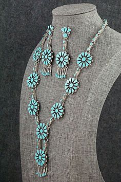 This beautiful turquoise and sterling silver necklace and earrings set was made by Zuni silversmith Merlinda Chavez. The back of the necklace is signed D & M Chavez and Zuni.Necklace: 24"Lariat Length: 2 3/4"Lariat Width: 7/8"Station Size: 7/8" x 7/8"Earrings:Length: 3"Width: 7/8"Free shipping on all orders! We ship with USPS and always include tracking. All orders ship within a day of payment.Returns are accepted up to 30 days after you receive your order. Just send us a message. Our shop offer Silver Necklace Set, Zuni Jewelry, Native American Jewelry, Native American Indians, Turquoise Sterling Silver, Free Jewelry, Sterling Silver Necklaces, Shades Of Blue, Necklace Set