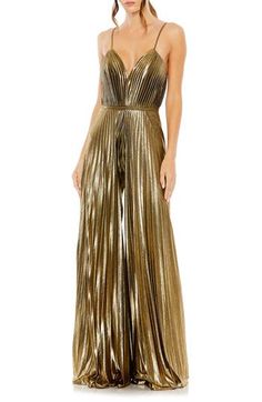 Enter your next special event in a disco-chic manner with this crisp, accordion-pleated jumpsuit styled with flowy wide legs, slender straps and a banded waist. 61" length; 31 1/2" inseam; 136" leg opening (size 8) Plunge neck Spaghetti straps Partially lined 100% polyester Spot clean Imported Asian Owned/Founded Pleated Jumpsuit, Formal Jumpsuit, Prom Girl, Mac Duggal, Jumpsuit Fashion, Sleeveless Jumpsuits, Gold Dress, Fashion Fabric, Wide Leg Jumpsuit