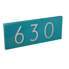 a blue house number sign with the number 630 on it's front and side