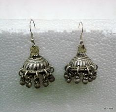 Vintage Antique collectible tribal old silver earring pair (Tokariya) from Rajasthan India. Worn by tribal womens of Rajasthan. Beautiful design adorn with silver bells. very good worn pair great for jewellery collection. Length with wire - 4.7 cm(1.85") Weight of pair - 23.5 gramsMaterial - silver & original old worn pair. Traditional Silver Jhumkas For Ceremonial Occasions, Silver Bohemian Jhumkas For Festivals, Silver Jhumkas For Ceremonial Occasions, Bohemian Jhumkas For Festivals, Silver Danglers For Festivals And Rituals, Traditional Silver Earrings With Tilla, Bohemian Jhumkas For Ceremonial Festivals, Silver Jhumkas With Latkans For Festival, Silver Danglers For Rituals And Festivals