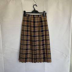 Vintage pleated wool skirt, made in Scotland ,Edinburgh. Traditional Scottish tartan, camel/tan & navy. Rigid waistband. Pleated around and stitched down to the hips. Fully lined.  Will fit a snug 24/26inch waist. Hips up to 36 inches. Knee length, 28 inch. In very good vintage condition. For more vintage clothes and accessories visit my shop https://www.etsy.com/uk/shop/coolclobber Scottish Style Pleated Skirt For Fall, Scotland Edinburgh, Kilt Skirt, Black Velvet Blazer, Tartan Skirt, Tartan Kilt, Hip Ups, Wool Skirt, Vintage Velvet