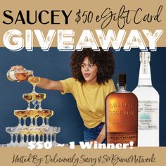 a woman is holding a bottle of liquor and pouring it into a glass with the words saucy $ 50 gift card giveaway