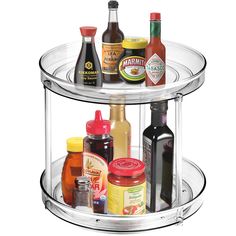 two tiered glass spice rack with condiments and condiments on top