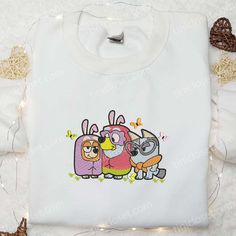 Bingo Lucky And Muffin Easter Bunny Embroidered Shirt, Bluey Cartoon Embroidered Hoodie, Thanksgiving Day Gift Idea Cute White Embroidered Hoodie, Cute Cotton Hoodie With Custom Embroidery, Cute Hooded Tops With Embroidered Graphics, White Hooded Top With Machine Embroidery, Bluey Embroidery Designs, White Embroidered Hooded Hoodie, Bluey Cartoon Embroidery, Bluey Cricut Shirt, Bluey Bingo Nike Sweatshirt