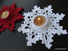 a crocheted snowflake with a candle on it