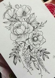 a black and white drawing of flowers on paper