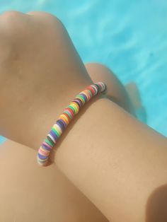 This is another one that is not stretchy but is still  a Fun rainbow bracelets hope you enjoy this fun bracelet Colorful Heishi Beads Bracelets For Friendship, Trendy Rainbow Round Beads Bracelets, Trendy Rainbow Bracelets With Round Beads, Trendy Colorful Heishi Beads Bracelets, Trendy Rainbow Friendship Bracelets With Round Beads, Trendy Colorful Heishi Beads Bracelet, Trendy Rainbow Friendship Bracelet With Round Beads, Trendy Multicolor Round Stretch Bracelet, Casual Multicolor Hypoallergenic Bracelets