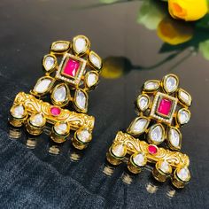 These are a beautiful pair of Earrings, made with beautifully Kundan beaded. These earrings work well with all types of clothing, whether it be formal attire or a casual party. Option 1 : Red Color (E716) Option 2 : Green Color (E717) Eye-catching and unique jewellery that will set you apart. Gift this piece to a loved one, and see their face light up with joy. Best for gifting or for personal use, wear it to any occasion and be in the spotlight.