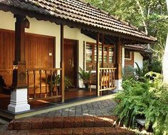 a small house with wooden doors and windows