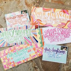 four colorful handmade greeting cards on a stone surface with the words, family and friends written in different colors