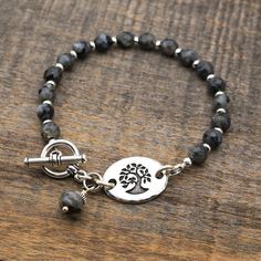 Black and grey tree bracelet, Norwegian moonstone semiprecious stone beads, silver, 7 3/4 inches lon Adjustable Sterling Silver Bracelet With Gemstone Beads, Silver Sterling Silver Gemstone Beaded Bracelets, Adjustable Gray Sterling Silver Jewelry, Silver Charm Bracelet With Gemstone Beads, Adjustable Silver Charm Bracelet With Gemstone Beads, Adjustable Silver Rosary Bracelet With Gemstone Beads, Silver Rosary Bracelet With Natural Stones As Gift, Adjustable Gray Jewelry With Natural Stones, Spiritual Silver Rosary Bracelet With Natural Stones