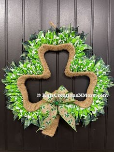 a wreath that has been made to look like the letter s is hanging on a door