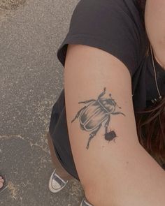 a lady with a small tattoo on her arm