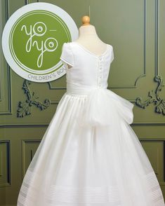 Geranio is the perfect dainty dress for first communion, made in off-white crystal organza. Super lightweight! It has buttons on the back for closure, the strings are made with french tulle so it creates a gorgeous draped bow. Made in Spain Dry Clean Final sale, no exchanges nor returns are available Fitted Tulle Ball Gown For First Communion, First Communion Tulle Ball Gown Dress, White Fitted Tulle First Communion Dress, Confirmation Gown With Fitted Bodice And Tulle, Tulle Ball Gown For First Communion Confirmation, Confirmation Ball Gown With Fitted Bodice, Confirmation Ball Gown With Fitted Bodice In Tulle, Tulle Dress With Fitted Bodice For Confirmation, Tulle Gown With Fitted Bodice For Confirmation