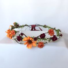 Orange daisy flower crown, Burnt orange flower head, Bridal headpiece, Orange burgundy flower crown, flower girl crown, Daisy halo →Designed with artificial orange daisy, orange burgundy roses and real dried baby's breath flowers. To add a special touch to your look, the beautiful flower crown is the perfect accessory for a party or wedding. Combined with a long soft ribbon at the back to fit any size, this flower crown is a great alternative to create a bohemian look for your wedding. All my pi Burgundy Flower Crown, Fall Flower Girl, Wildflower Crown, Flower Crown Flower Girl, Daisy Flower Crown, Fall Flower Crown, Orange Daisy, Orange Wedding Flowers, Burnt Orange Weddings