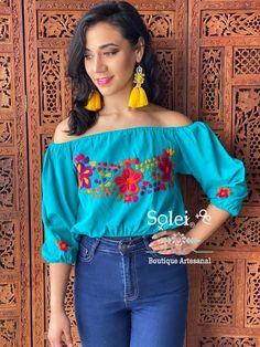 This Beautiful Off the Shoulder Crop Top is the perfect Top for a fun day out. It's made out of cotton and has hand embroidered flowers on the front and on the sleeves. Please note: This blouse comes in one size which fits sizes Small and Medium. This blouse is hand embroidered and the embroidered colors vary on each blouse making each blouse one of a kind. More colors available here: https://www.etsy.com/es/listing/726742179/crop-top-floral-hermosa-blusa-bordada-a?ref=listings_manager_grid Purc Cute Embroidered Tops For Vacation, Cute Multicolor Embroidered Tops For Spring, Cute Multicolor Embroidery Tops For Spring, Cute Embroidered Summer Tops, Cute Embroidered Beach Tops, Cute Multicolor Cotton Blouse, Cute Multicolor Embroidered Tops For Summer, Festival Cotton Tops With Floral Embroidery, Blue Cotton Embroidered Summer Top