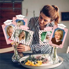 a woman sitting at a table in front of a plate with flowers and vases