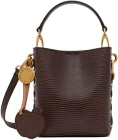 Croc-embossed UPPEAL™️ faux-leather shoulder bag in brown. · Detachable carry handle · Adjustable and detachable shoulder strap · Lace-up detailing at sides · Logo tag and disc at side · Magnetic closure · Patch pocket at interior · Faux-suede recycled nylon lining · Gold-tone hardware · H6.75 x W5.75 x D3 Made from cruelty-free, non-animal materials. Supplier color: Chocolate brown Designer Brown Bucket Bag With Detachable Strap, Luxury Brown Bucket Bag With Detachable Strap, Luxury Brown Bucket Bag With Removable Pouch, Luxury Brown Shoulder Bag With Adjustable Strap, Luxury Brown Bucket Bag With Detachable Handle, Luxury Brown Crossbody Bucket Bag, Luxury Brown Satchel Bucket Bag, Brown Textured Leather Evening Bucket Bag, Brown Textured Leather Bucket Bag For Evening