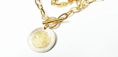 "I love the uniqueness of coins from around the globe! This 5 Mexican peso coin is beautiful worn as a necklace, bracelet, or bangle and will be a go to statement piece for a lifetime! Want to give it to the man in your life? How about a Key Chain or Swivel Hook instead? (year is 2016) 25mm (1 inch) coin adorns your choice of stainless steel toggle necklace or bracelet, stainless steel cable necklace, gold plated bangle, gold plated key ring or swivel hook. Comes boxed and ready to give as a gif Metal Coin Necklace Perfect As A Gift, Medallion Coin Necklace In Metal As Gift, Nickel-free Round Metal Coin Necklace, Metal Round Coin Necklace As A Gift, Round Metal Coin Necklace As A Gift, Engraved Round Metal Coin Necklace, Metal Coin Medallion Necklace, Gold Stamped Metal Jewelry, Engraved Metal Coin Necklace