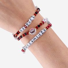 Accessorize and maximize your fandom while impressing your fellow fans with this Tampa Bay Buccaneers 3 Pack Friendship Bracelet. These matching friendship bracelets have an all-over team-colored design and team logo displays, which makes them the perfect way to show your support for the Tampa Bay Buccaneers and get in on the latest accessory craze. Every bead bracelet design is the perfect addition to your outfit, whether you’re heading to the game, watching at home, or just hanging out with fr Matching Friendship Bracelets, Football Bracelet, Cool Friendship Bracelets, Buccaneers Football, Friendship Bracelets With Beads, Beads Bracelet Design, Bracelet Design, Tampa Bay Buccaneers, Colored Gems