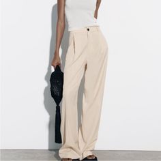 High Waist Pants With Front Pockets And Back False Welt Pockets. Pleat Detail. Front Zip And Button Closure. New With Tags. Usa S, Mex 26, Uk S, It S, Br P Art: 7385/431/727 Zara Jumpsuit, Zara New, High Waist Pants, Zara Pants, Waist Pants, New Woman, Cream White, High Waisted Pants, Welt Pockets