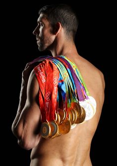 a man with medals on his back in the dark