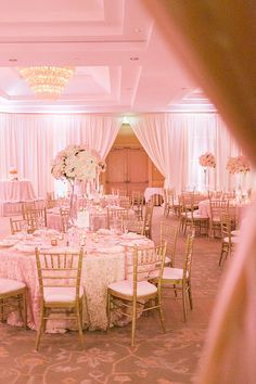 an elegant wedding reception with pink and white decor